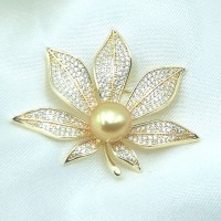 Gold leaf brooch with central pearl and sparkling crystal details